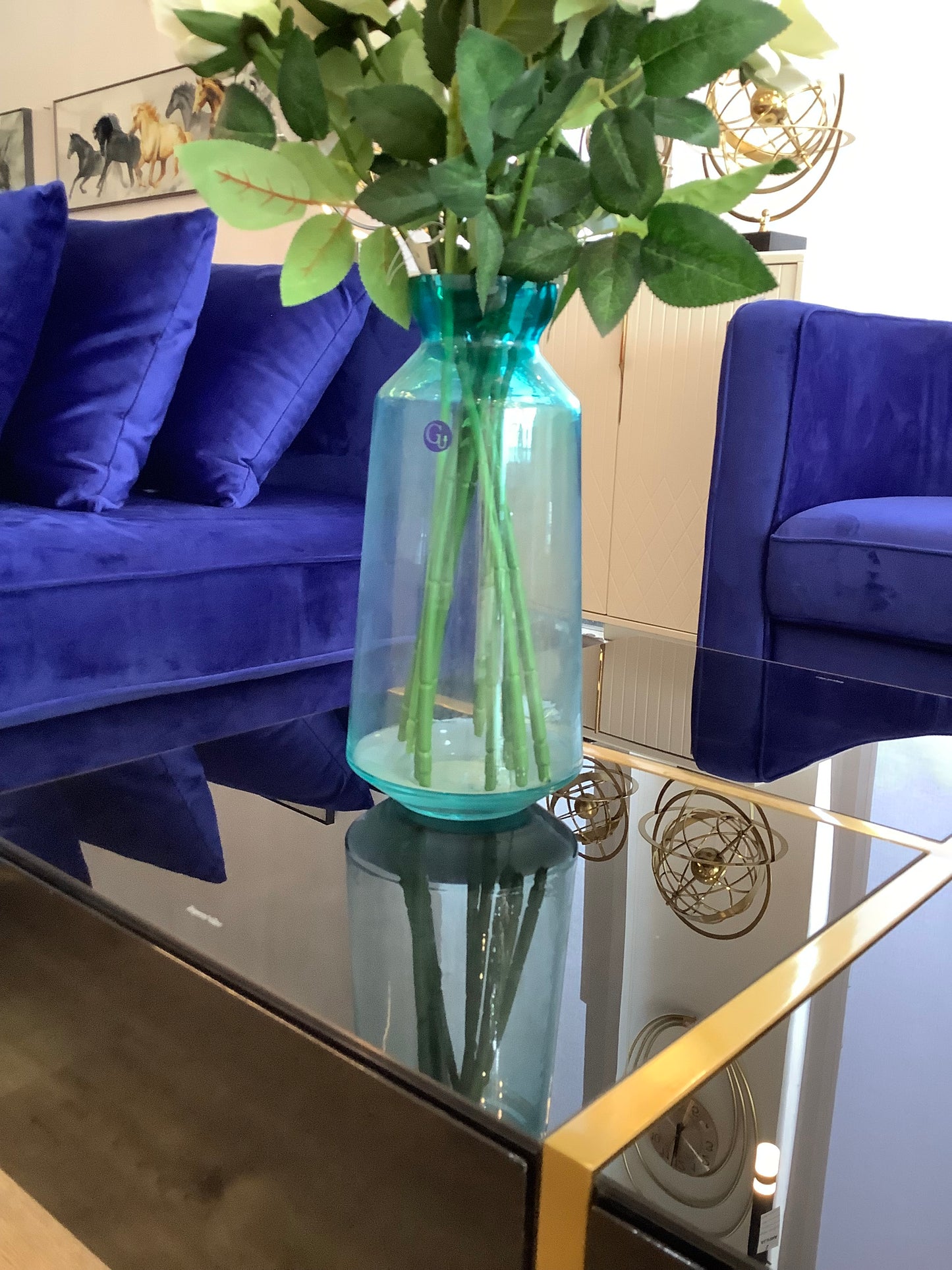Glass vase and white roses