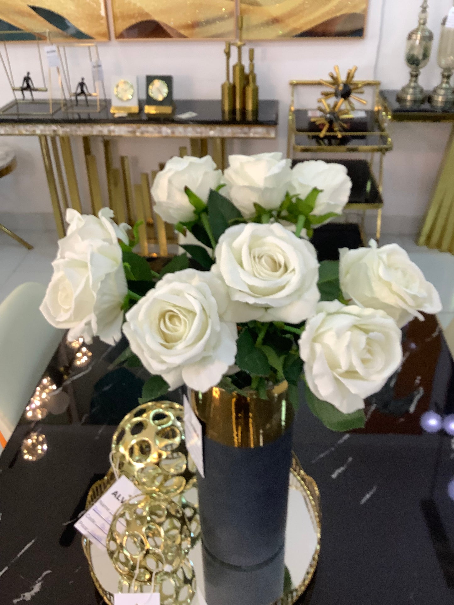 Black and gold vase with rose